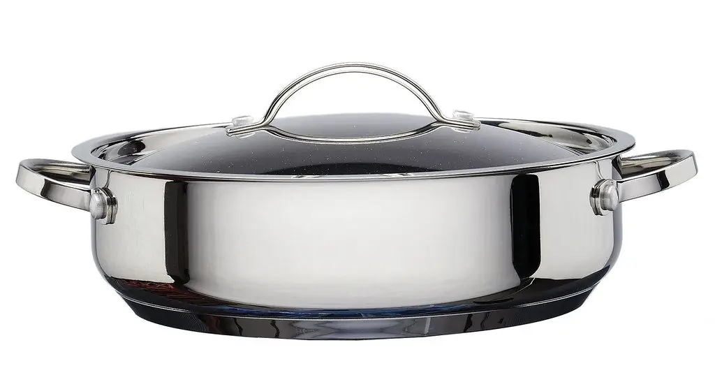 Enamel stockpot with a lid on the stove
